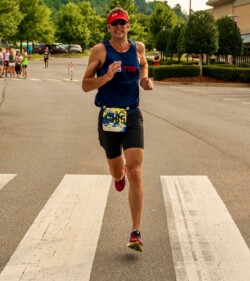 Finish line photo from a 5K race. Running has helped me with my cholesterol.